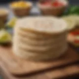 A selection of low-carb tortillas arranged on a wooden cutting board.