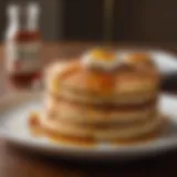 Warm freshly baked pancakes with maple syrup