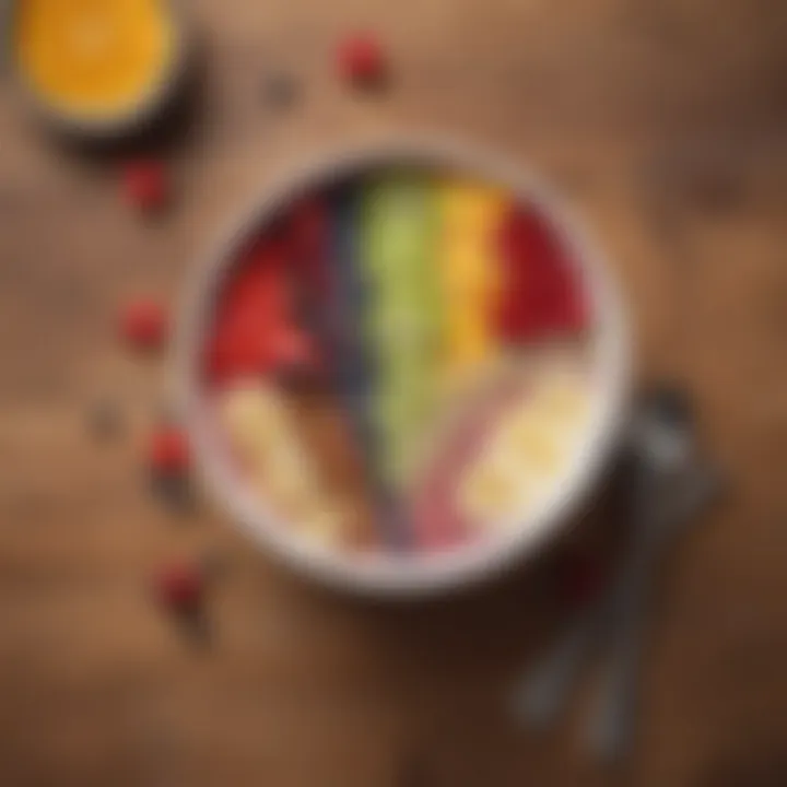 An artistic arrangement of a smoothie bowl with a spoon on a wooden table