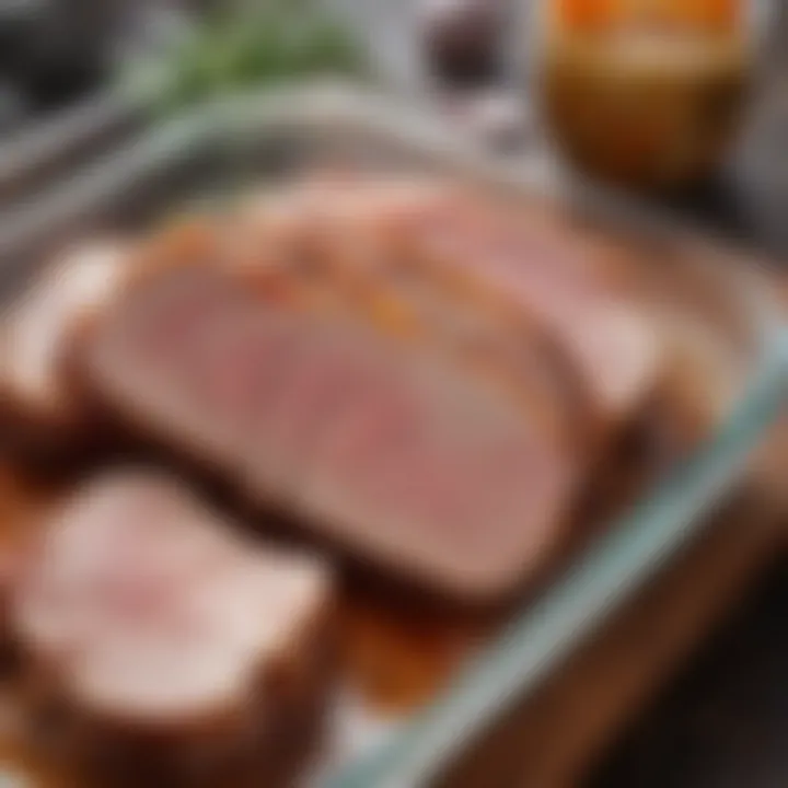 Pork cuts marinating in a glass container