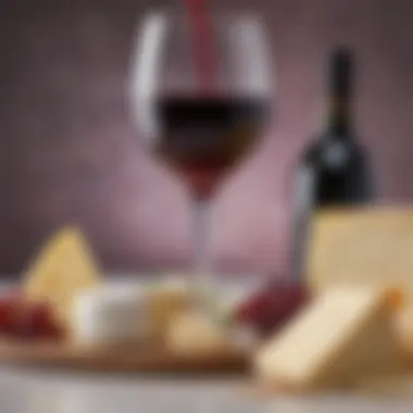 Close-up of a glass of red wine paired with a selection of creamy cheeses