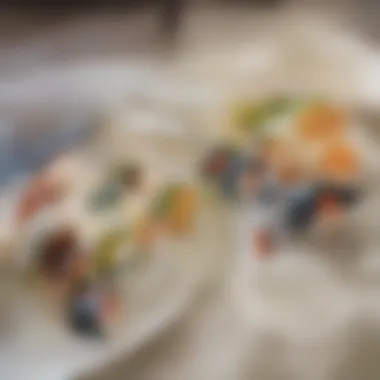Artistic Sushi Rolls Presentation A colorful platter featuring sushi rolls with intricate designs.