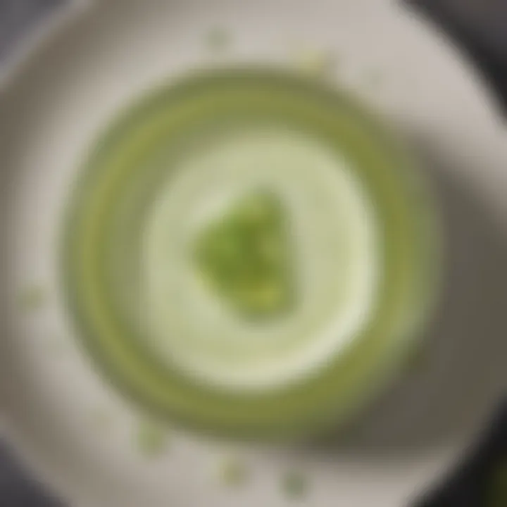 Chilled cucumber soup served in an elegant glass with a drizzle of olive oil