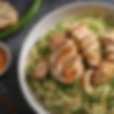 Zucchini Noodles with Savory Chicken A close-up of a delicious zucchini noodle bowl topped with diced chicken and fresh herbs