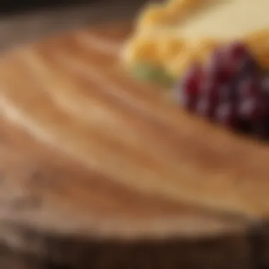 Close-up of wood grain highlighting the texture and quality of a cheese board.