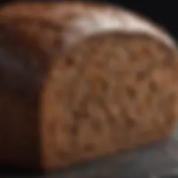 A close-up view of pumpernickel bread showcasing its dense texture and rich color