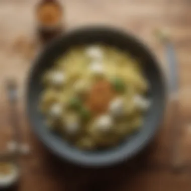 Mozzarella and Pesto Pasta Delight A beautifully presented mozzarella and pesto pasta dish garnished with pine nuts.