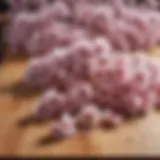 A close-up of salted cherry blossoms arranged elegantly on a wooden board