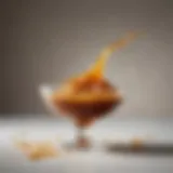 Rich golden caramel poured into a delicate glass dish