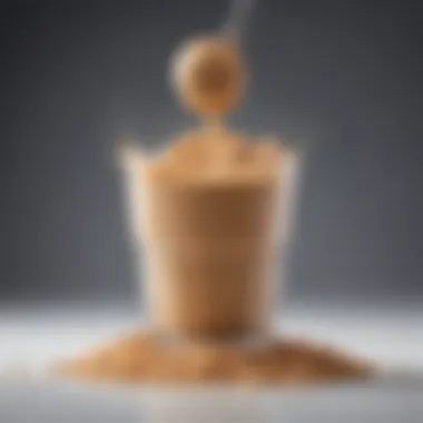 Close-up of a protein powder scoop and a smoothie