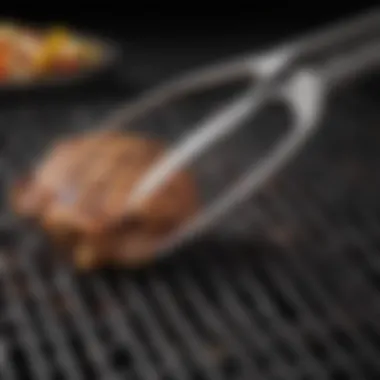 Close-up of the gripping mechanism of grill tongs