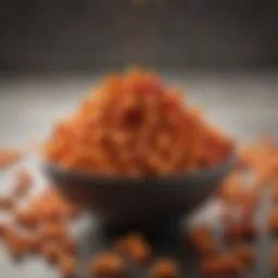 A vibrant bowl of crushed Hot Cheetos for coating