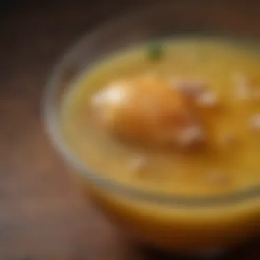 The Golden Elixir: Homemade Chicken Stock A close-up of the rich, golden liquid of homemade chicken stock