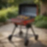 Stylish portable grill with wheels in a backyard setting