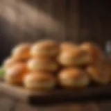 Artisan giant hamburger buns displayed on a rustic wooden table