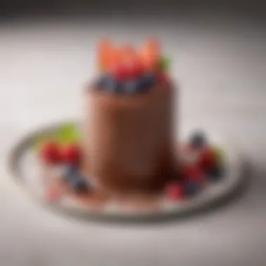 A close-up of a rich chocolate mousse topped with fresh berries.