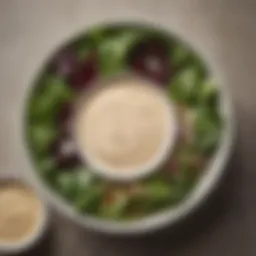 A vibrant bowl of chipotle yogurt dressing drizzled over fresh mixed greens.