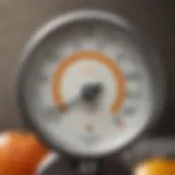 A detailed view of an oil thermometer showcasing its dial and scale.